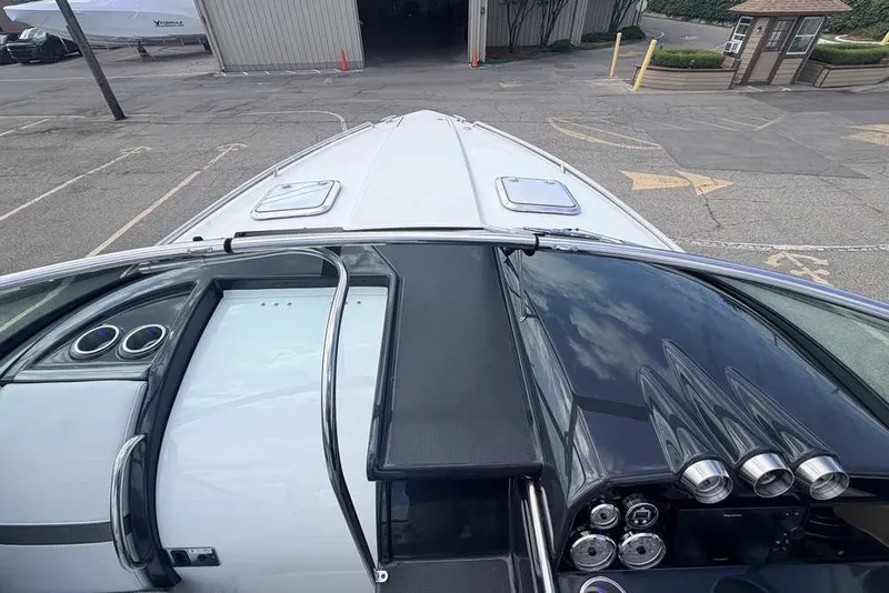 Slide: The Image of 2018 Formula 290 Sun Sport boat dashboard and bow view at marina. - 27