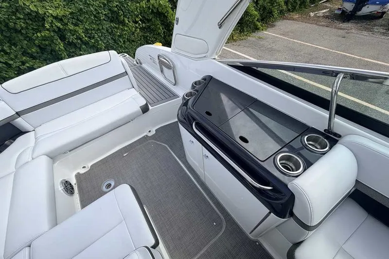 Slide: The Image of 2018 Formula 290 Sun Sport boat interior with white seating and sleek design. - 19