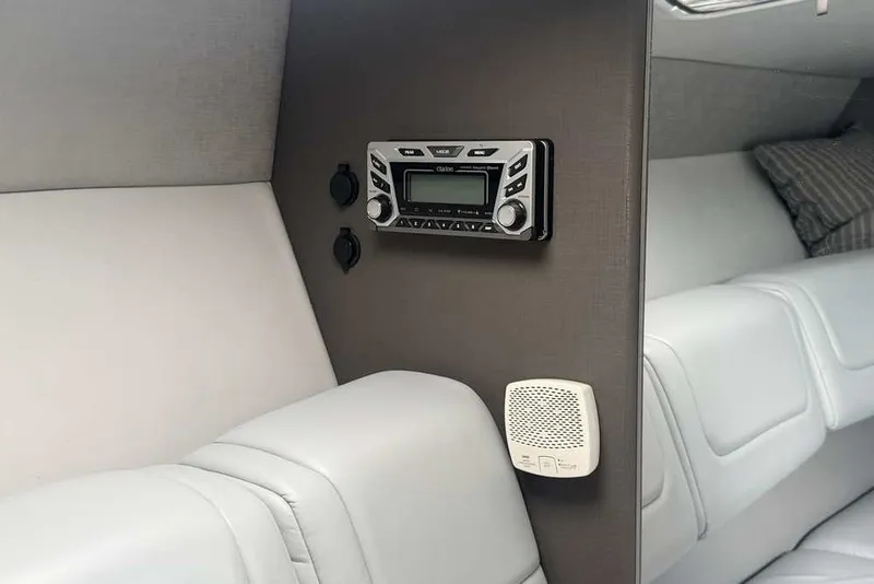 Slide: The Image of Interior of 2018 Formula 290 Sun Sport boat with stereo system and white seating. - 41