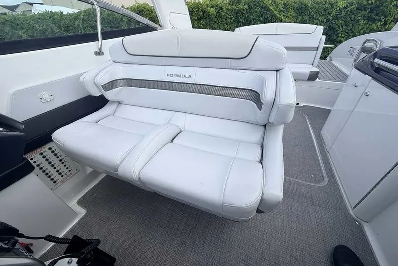 Slide: The Image of Luxurious seating on 2018 Formula 290 Sun Sport boat, featuring sleek white upholstery. - 29