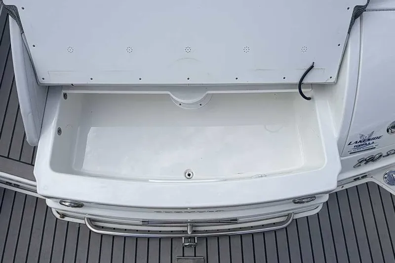 Slide: The Image of 2018 Formula 290 Sun Sport boat storage compartment on deck. - 11