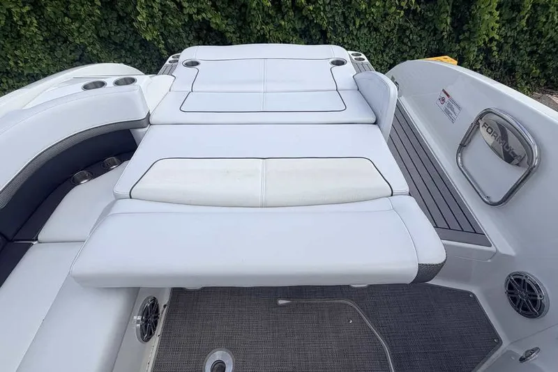 Slide: The Image of 2018 Formula 290 Sun Sport boat with spacious white seating and cup holders. - 9