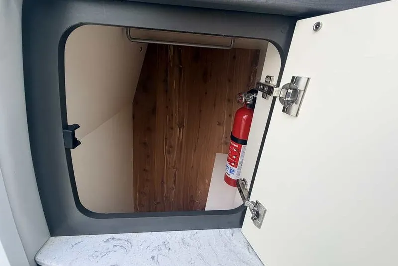 Slide: The Image of Cabinet interior of 2018 Formula 290 Sun Sport with fire extinguisher. - 45