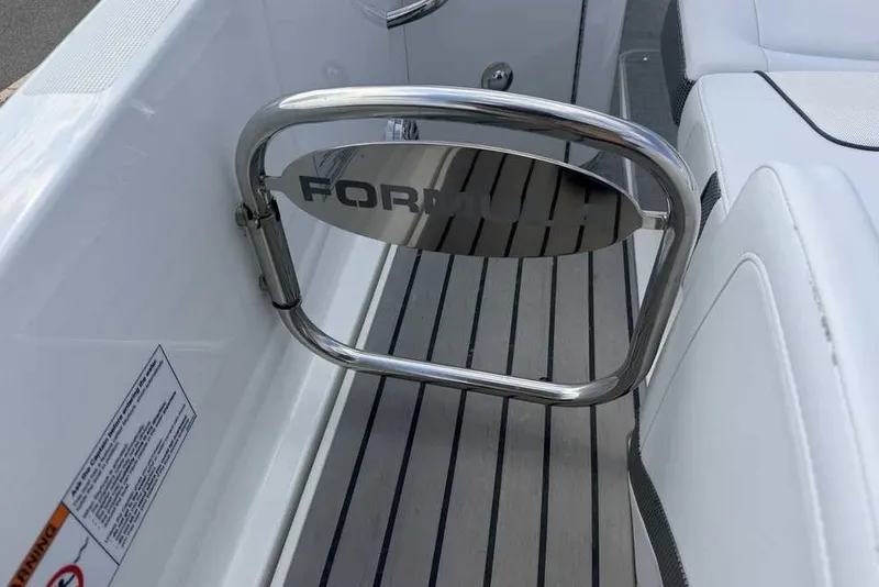 Slide: The Image of 2018 Formula 290 Sun Sport boat interior with branded metal gate and sleek seating. - 14