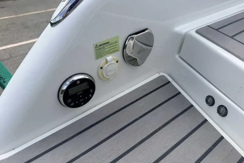 Slide: The Image of 2018 Formula 290 Sun Sport boat deck with controls and warning label. - 12