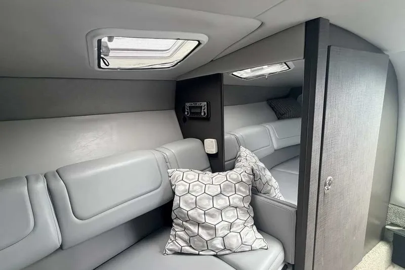 Slide: The Image of Interior cabin of 2018 Formula 290 Sun Sport with modern seating and pillows. - 40