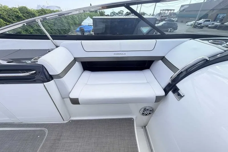 Slide: The Image of 2018 Formula 290 Sun Sport boat interior with white seating and sleek design. - 25
