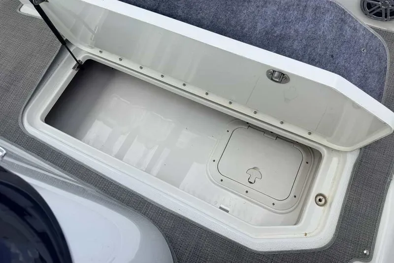 Slide: The Image of Open storage compartment on 2018 Formula 290 Sun Sport boat, featuring carpeted flooring. - 24