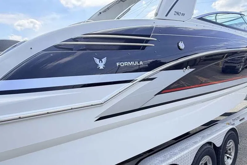 Slide: The Image of 2018 Formula 290 Sun Sport boat on trailer, sleek design with logo visible. - 4