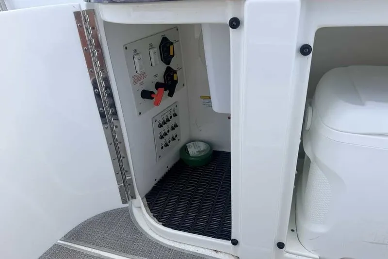 Slide: The Image of 2018 Formula 290 Sun Sport boat interior compartment with control panel and storage. - 20