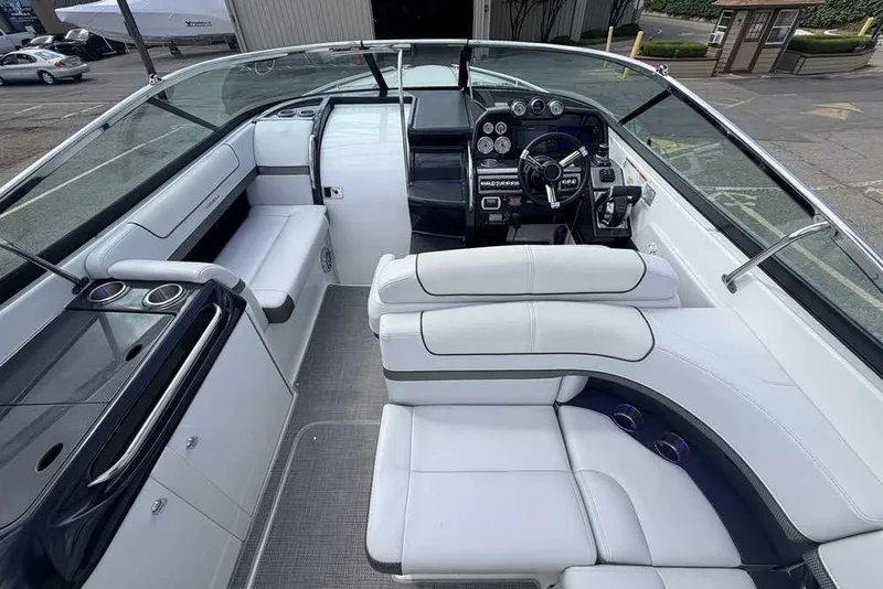 Slide: The Image of 2018 Formula 290 Sun Sport boat interior with sleek white seating and modern dashboard. - 28