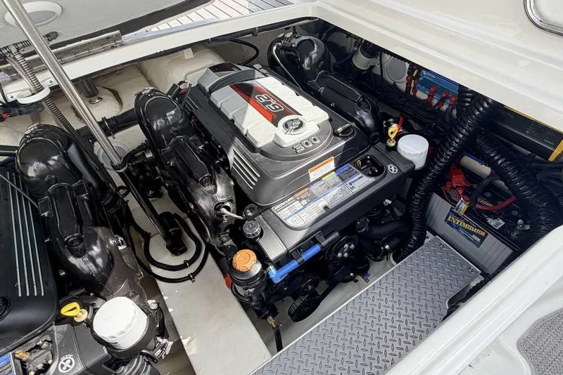 Slide: The Image of Engine compartment of a 2018 Formula 290 Sun Sport boat, showcasing detailed components. - 47