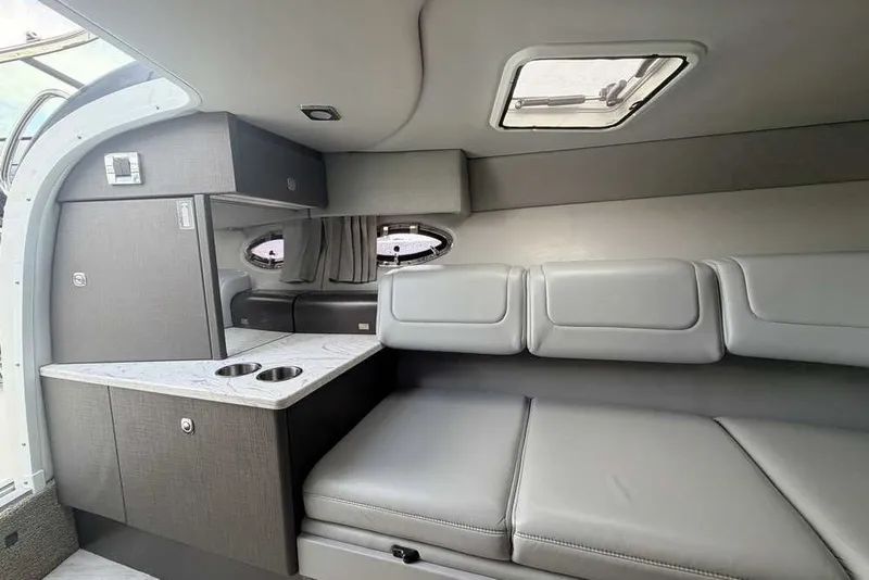 Slide: The Image of Interior of a 2018 Formula 290 Sun Sport boat, featuring sleek seating and modern cabinetry. - 39