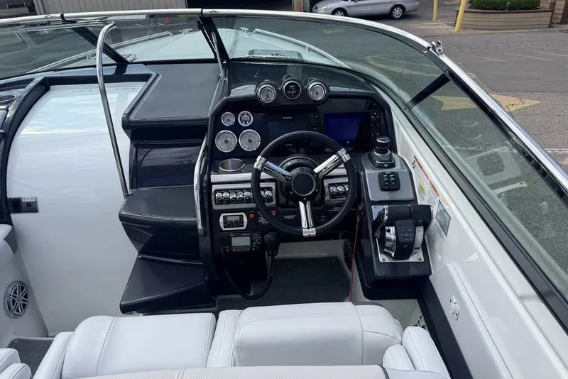 Slide: The Image of Cockpit of 2018 Formula 290 Sun Sport boat with steering wheel and control panel. - 33
