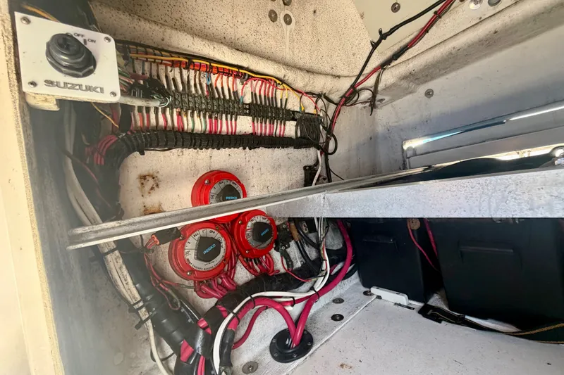 Slide: The Image of Electrical wiring and components inside a 2001 Intrepid 322 Cuddy boat. - 12