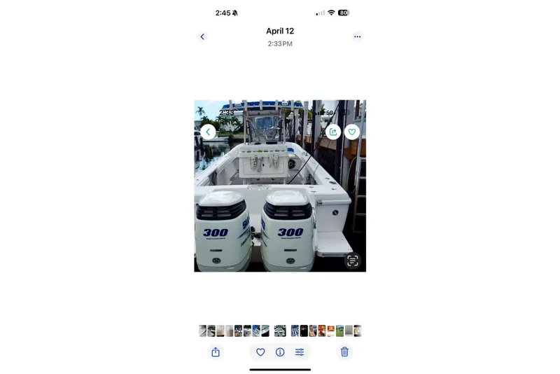 Slide: The Image of 2001 Intrepid 322 Cuddy boat with twin 300 horsepower engines docked. - 5