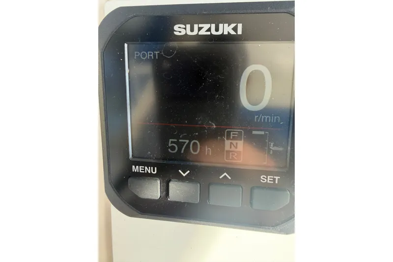 Slide: The Image of Suzuki engine display showing 570 hours on a 2001 Intrepid 322 Cuddy boat. - 11