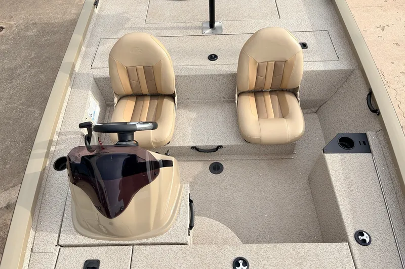 Slide: The Image of 2021 G3 Sportsman 1610 boat interior with two beige seats and steering console. - 20