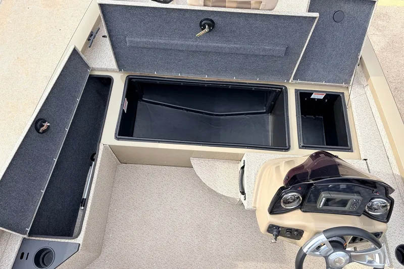 Slide: The Image of 2021 G3 Sportsman 1610 boat interior with storage compartments and control console. - 19