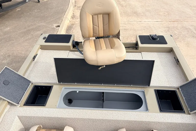 Slide: The Image of 2021 G3 Sportsman 1610 boat interior with beige seat and storage compartments. - 31