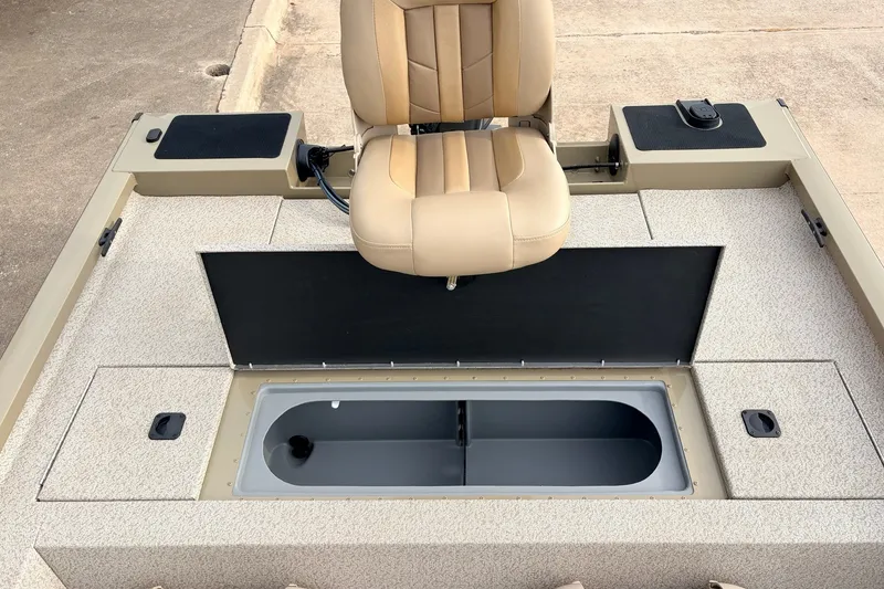 Slide: The Image of 2021 G3 Sportsman 1610 boat interior with beige seat and storage compartment. - 27