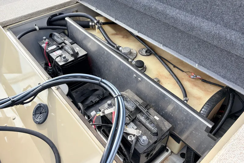 Slide: The Image of 2021 G3 Sportsman 1610 boat battery compartment with wiring and connections. - 33