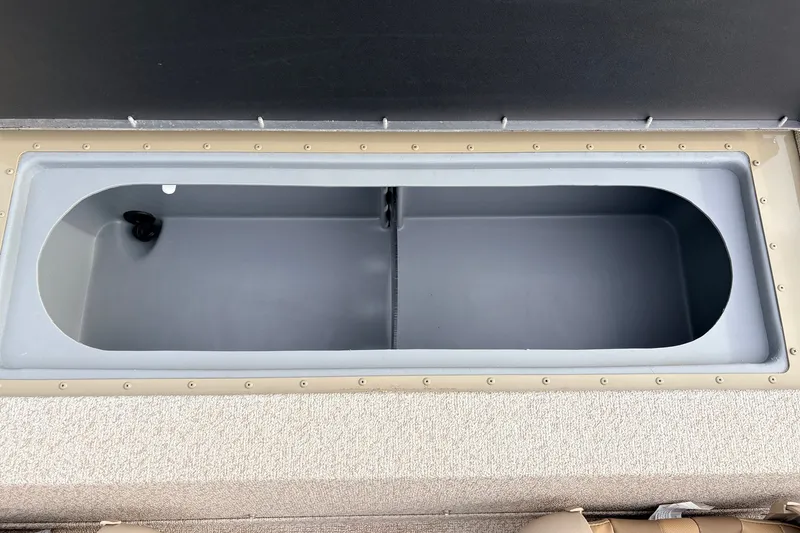 Slide: The Image of 2021 G3 Sportsman 1610 boat storage compartment, open and empty. - 28