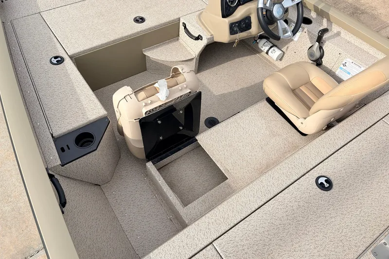 Slide: The Image of 2021 G3 Sportsman 1610 boat interior with beige seating and steering console. - 23