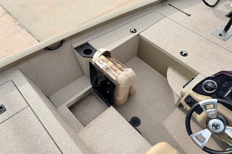 Slide: The Image of 2021 G3 Sportsman 1610 boat interior with steering wheel and seating area. - 22