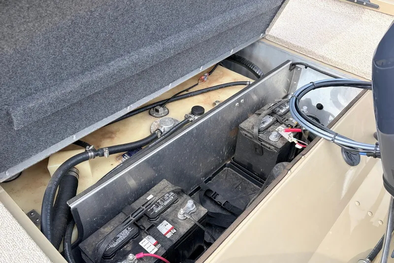 Slide: The Image of 2021 G3 Sportsman 1610 boat battery compartment with wiring and fuel tank. - 32