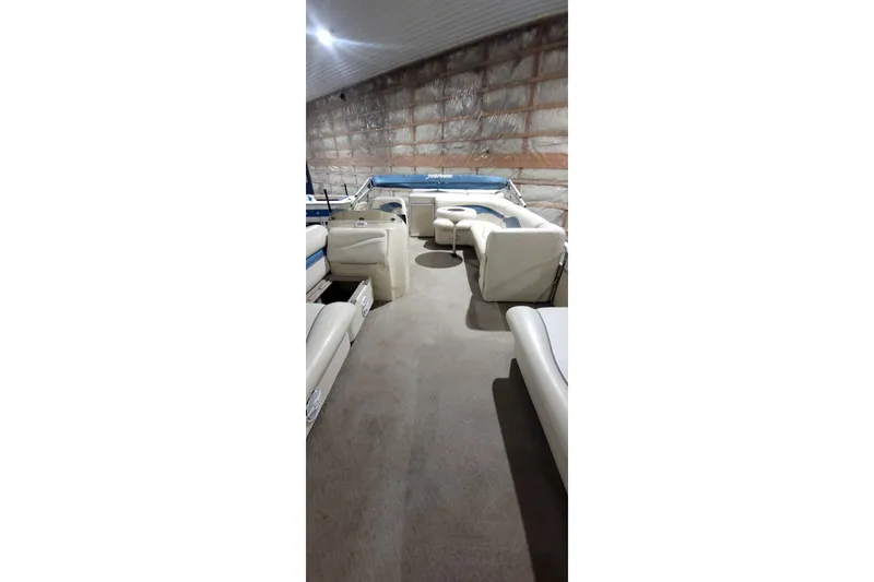 Slide: The Image of Interior of a 2006 Sweetwater 2386RE pontoon boat with spacious seating. - 19