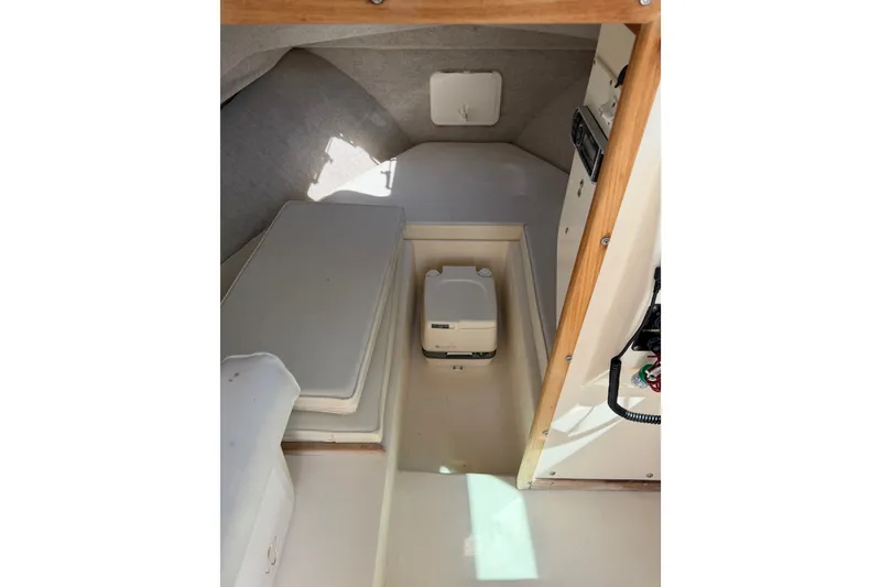 Slide: The Image of 2005 Parker 2520 Modified Vee Sport Cabin interior with seating and storage. - 23