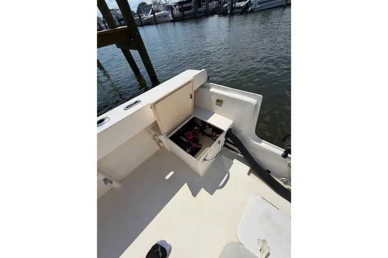 Slide: The Image of 2005 Parker 2520 Modified Vee Sport Cabin boat interior with open storage compartment. - 14