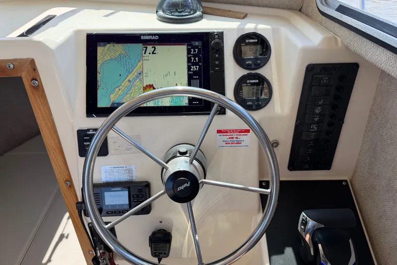 Slide: The Image of Helm of 2005 Parker 2520 Modified Vee Sport Cabin with navigation instruments and steering wheel. - 20