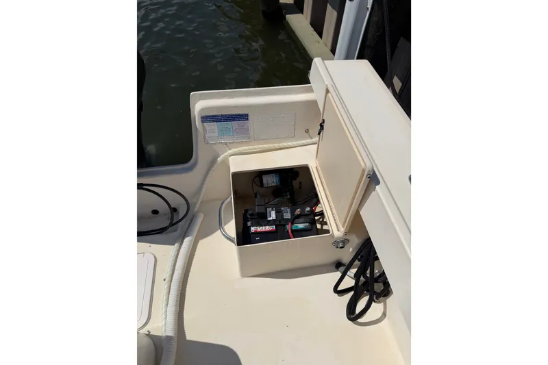Slide: The Image of Open battery compartment on 2005 Parker 2520 Modified Vee Sport Cabin boat. - 13