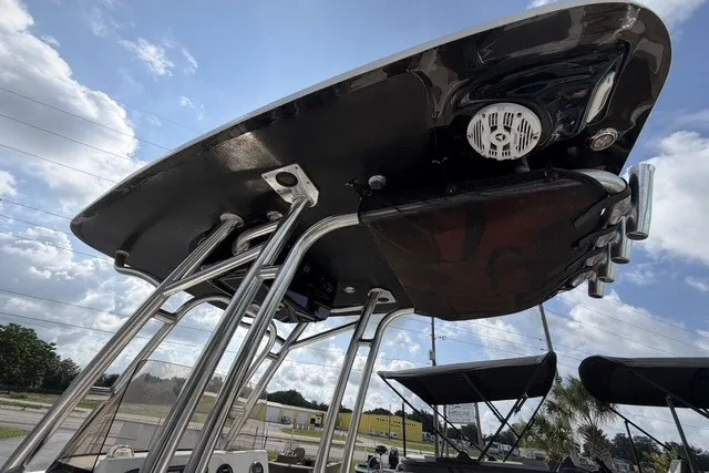 Slide: The Image of 2017 Key West 239 FS boat with T-top and speaker system under a cloudy sky. - 12