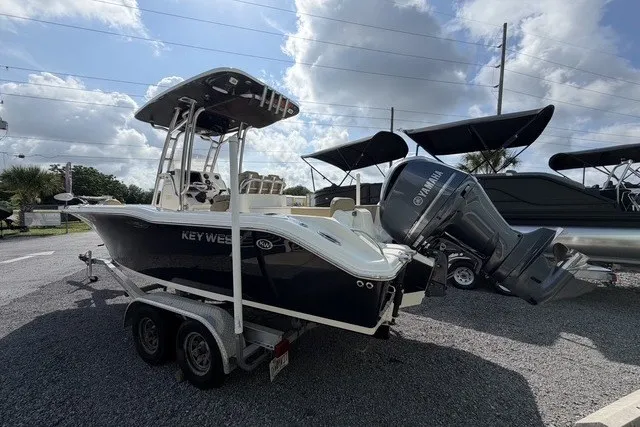 Slide: The Image of 2017 Key West 239 FS boat with Yamaha engine on trailer, parked outdoors. - 5