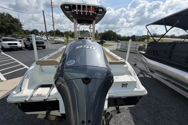 Slide: The Image of 2017 Key West 239 FS boat with powerful 250 engine, parked outdoors. - 7