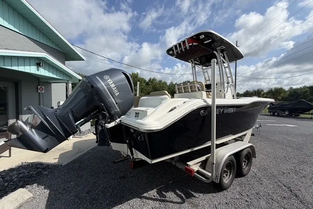 Slide: The Image of 2017 Key West 239 FS boat on trailer with Yamaha outboard motor, parked outdoors. - 6