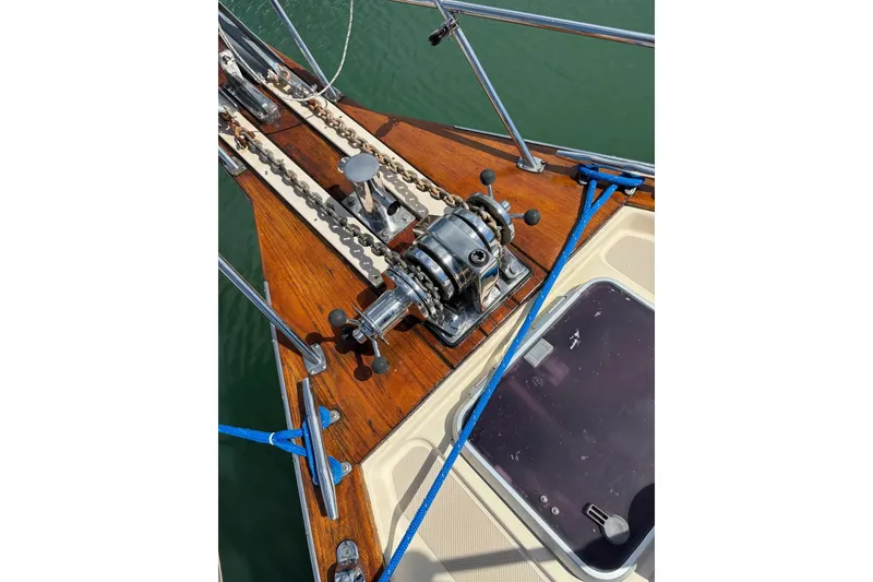 Slide: The Image of Deck of 2006 Island Packet 440 sailboat with anchor windlass and blue ropes. - 77
