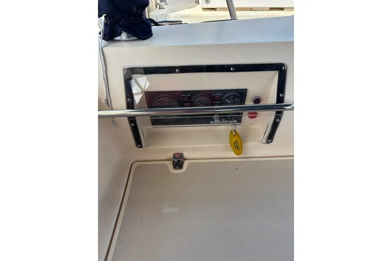 Slide: The Image of Control panel of a 2006 Island Packet 440 sailboat with gauges and key. - 62
