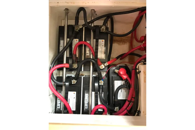Slide: The Image of Battery compartment of a 2006 Island Packet 440 sailboat with Lifeline batteries. - 13