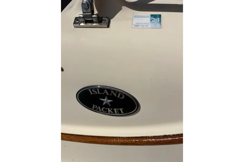 Slide: The Image of Island Packet 440 sailboat emblem, 2006 model, with registration sticker. - 55