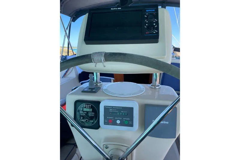 Slide: The Image of Steering console of a 2006 Island Packet 440 sailboat with navigation equipment. - 31