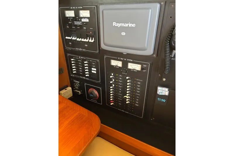 Slide: The Image of Electrical control panel on a 2006 Island Packet 440 yacht with Raymarine equipment. - 59