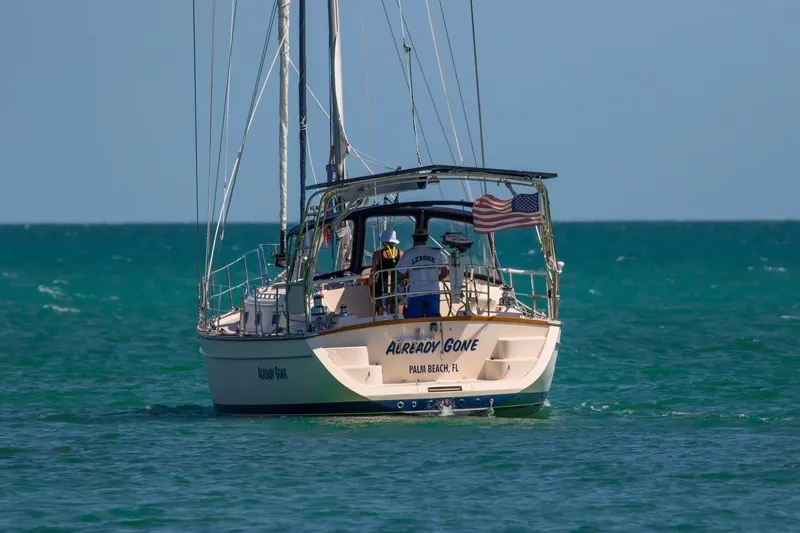 Slide: The Image of Sailboat "Already Gone," Island Packet 440, 2006, cruising in clear blue waters. - 76