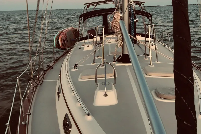 Slide: The Image of Sailing on a 2006 Island Packet 440 yacht, deck view over calm waters. - 21