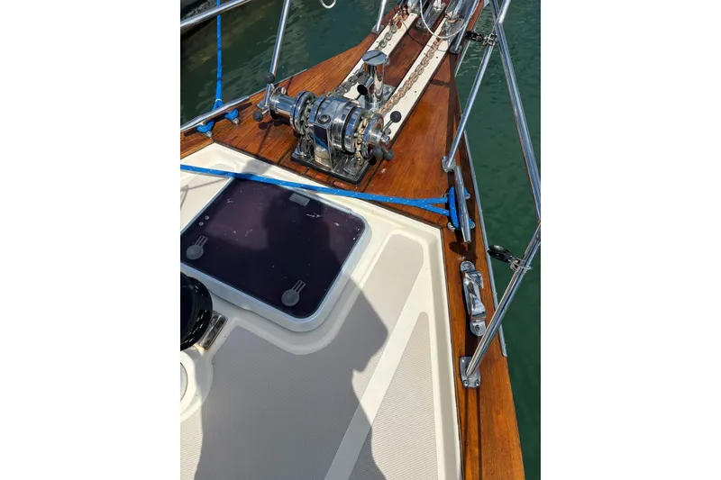 Slide: The Image of Deck of 2006 Island Packet 440 sailboat with anchor winch and hatch. - 40