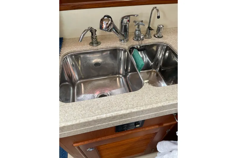 Slide: The Image of Stainless steel double sink in 2006 Island Packet 440 yacht kitchen. - 71