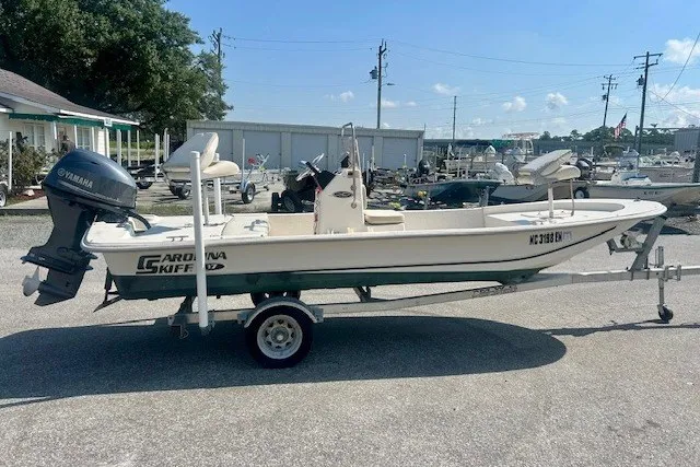 Slide: The Image of 2019 Carolina Skiff 17 JV CC boat on trailer with Yamaha outboard motor. - 18